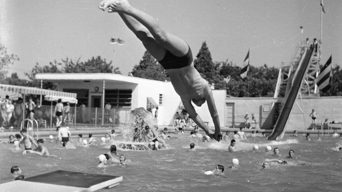 A man dives at the Land Park Plunge, an outdoor swimming facility that opened on Riverside Boulevard in Sacramento in 1937. The pool closed in 1955, a few years after a lawsuit forced its owners to stop excluding people of color. 