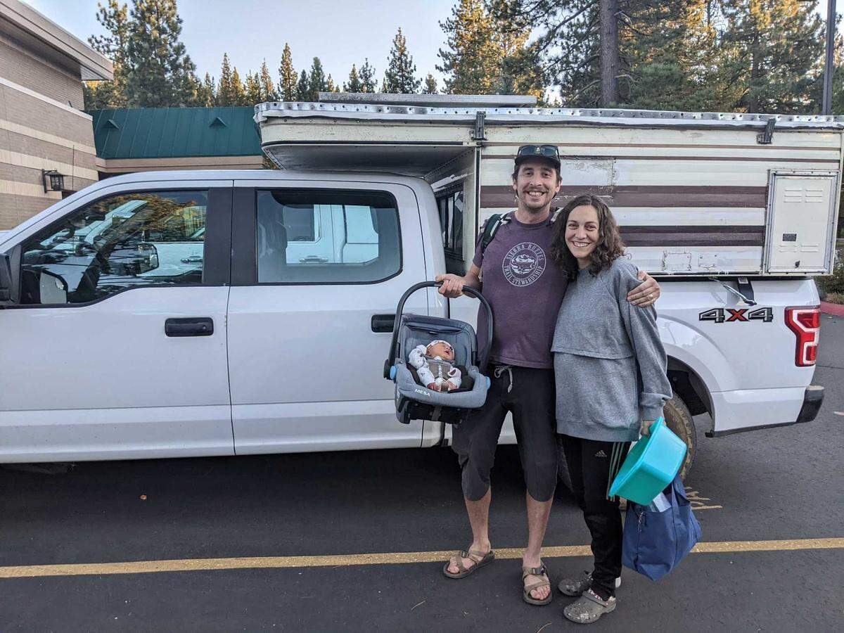 Alex Terry, left, and Jessie Mazar leave Tahoe Forest Hospital in Truckee with their newborn. The hospital is the closest one to their home in Quincy — about an hour and a half away on winding roads.