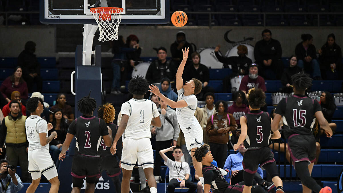 Venture Academy’s Mario Williams draws a foul during the Sac-Joaquin Section Division IV championship game with Natomas at UC Davis on Friday. Williams scored 39 points to lead Venture Academy to the section title with a 78-74 win over the Nighthawks.