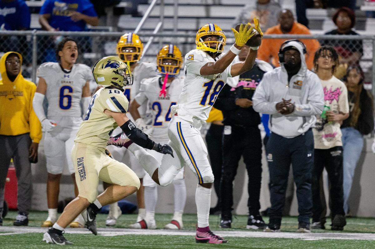 The Grant High Pacers wide receiver Zo Edwards (18) catches a pass past West Park Panthers defensive back Nick Pajcin (18) in the first half on Friday, Oct. 11, 2024, in Roseville.