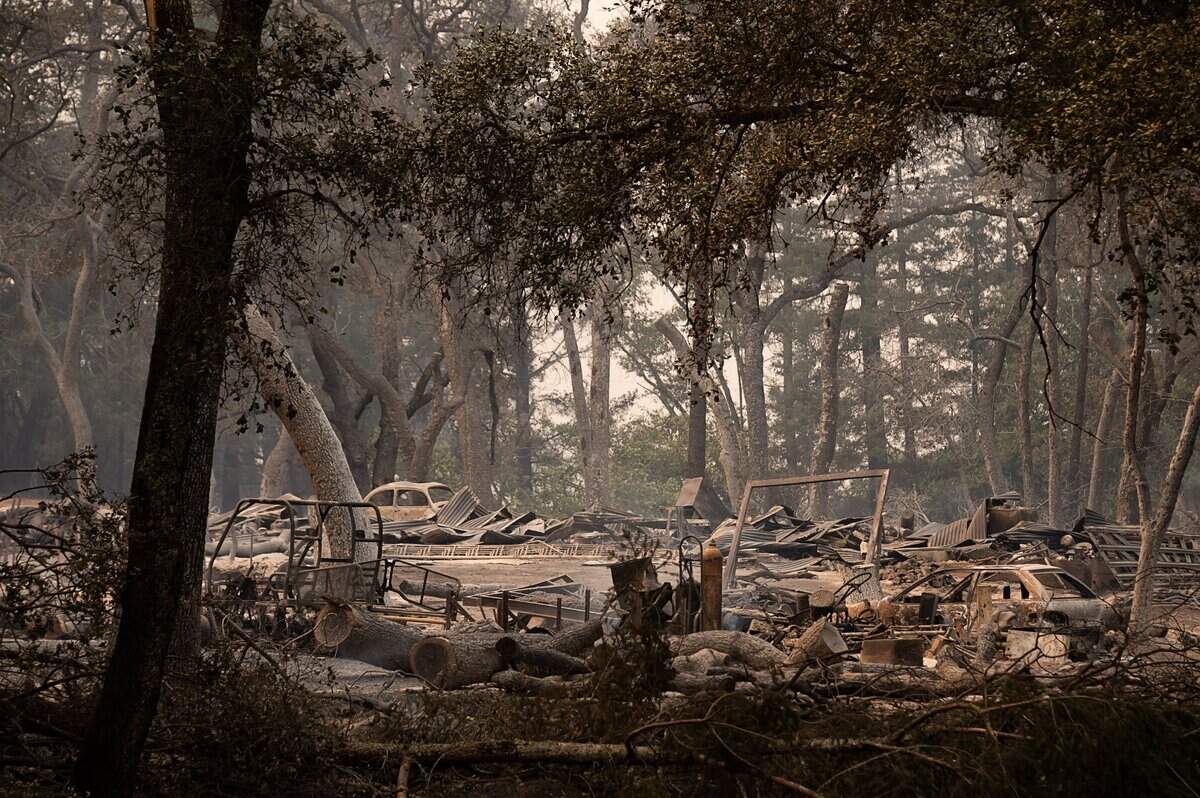 The remains of homes and autos off Deer Park Road were destroyed during the Glass Fire in Napa County on Monday, Sept. 28, 2020, in St. Helena.