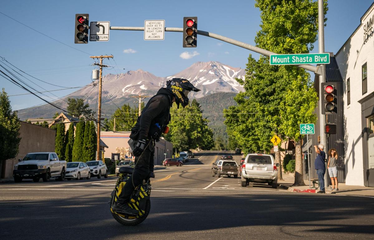 A uni-motorist zips down Mount Shasta Boulevard in Mount Shasta on Aug. 10. In Siskiyou County, about 28% of voters are registered as Democrat and about 44% as Republican. Siskiyou’s Democratic numbers are due in large part to the 3,200-person town of Mount Shasta, along with the neighboring blue-leaning towns of Weed and Dunsmuir.