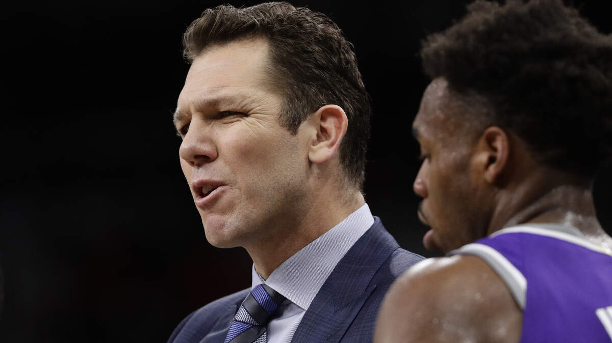 Sacramento head coach Luke Walton talks to his players during the first half Friday as his team allowed the San Antonio Spurs to build a 10-point halftime lead.
