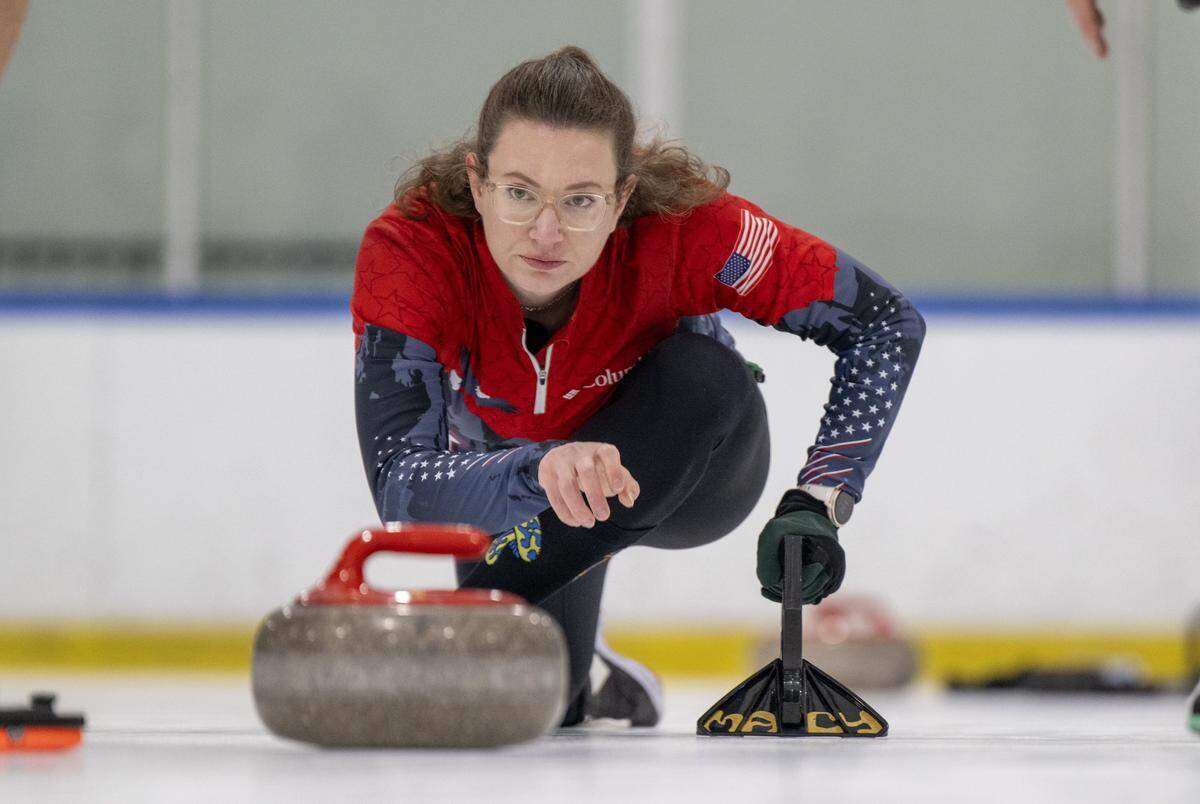 Eran Foley of Sacramento releases the curling stone during a match earlier this month at Skatetown Ice Arena in Roseville.