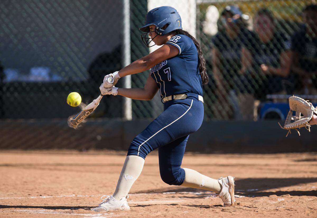 Central Catholic Raiders batter Mya Robles (7) connects for a shallow single to right field against the Ponderosa Bruins during the fourth inning of the CIF Northern California Division III softball championship game Saturday, June 3, 2023, at Ponderosa High School in Shingle Springs.