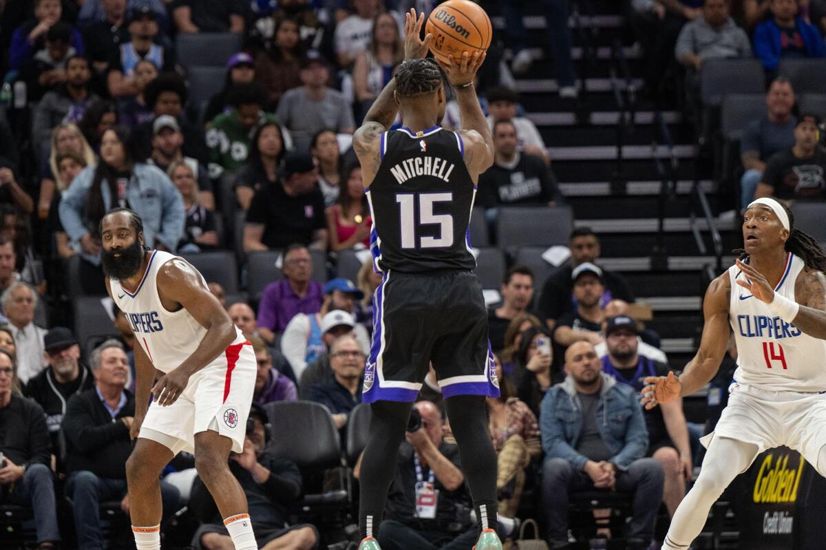 Sacramento Kings guard Davion Mitchell (15) hits a three point basket during an NBA game against the Los Angeles Clippers on Tuesday, April 2, 2024, at Golden 1 Center.