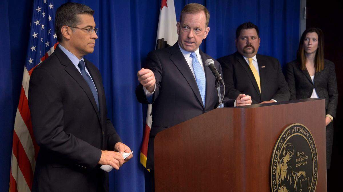 California State Attorney General Xavier Becerra, left, and U.S. Attorney McGregor Scott speak to members of the press in Sacramento on Thursday, April 26, 2018, about the arrest of Modesto physician Sawtantra Kumar Chopra.