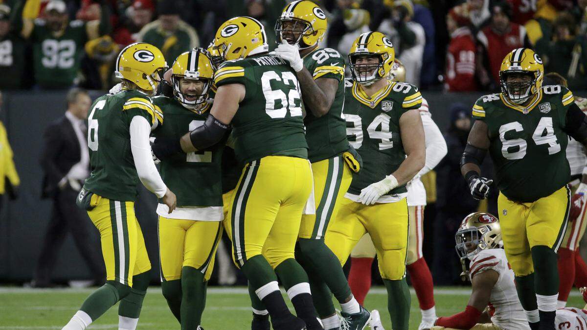 Green Bay Packers kicker Mason Crosby, second from left, celebrates with his teammates after kicking a game-winning field goal against the 49ers on Monday in Green Bay, Wis. The Packers won 33-30.