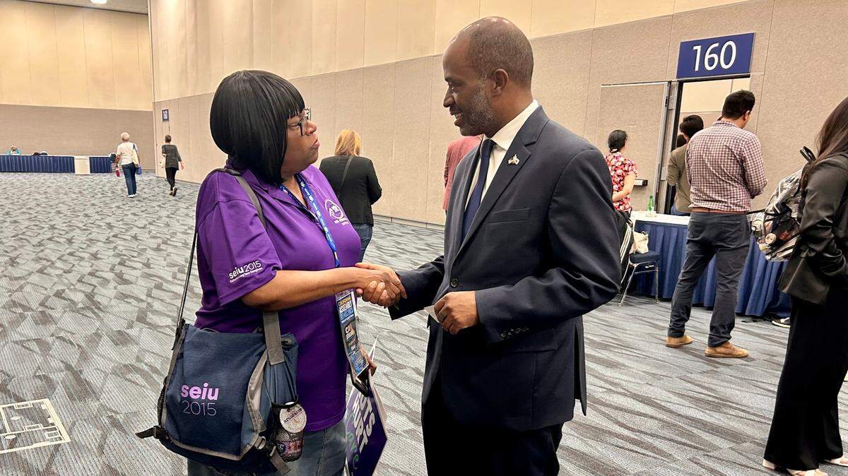 Tony Thurmond, California Superintendent of Public Instruction and 2026 candidate for governor, greets a supporter at the state Democratic convention in Anaheim on Saturday, May 31, 2025.