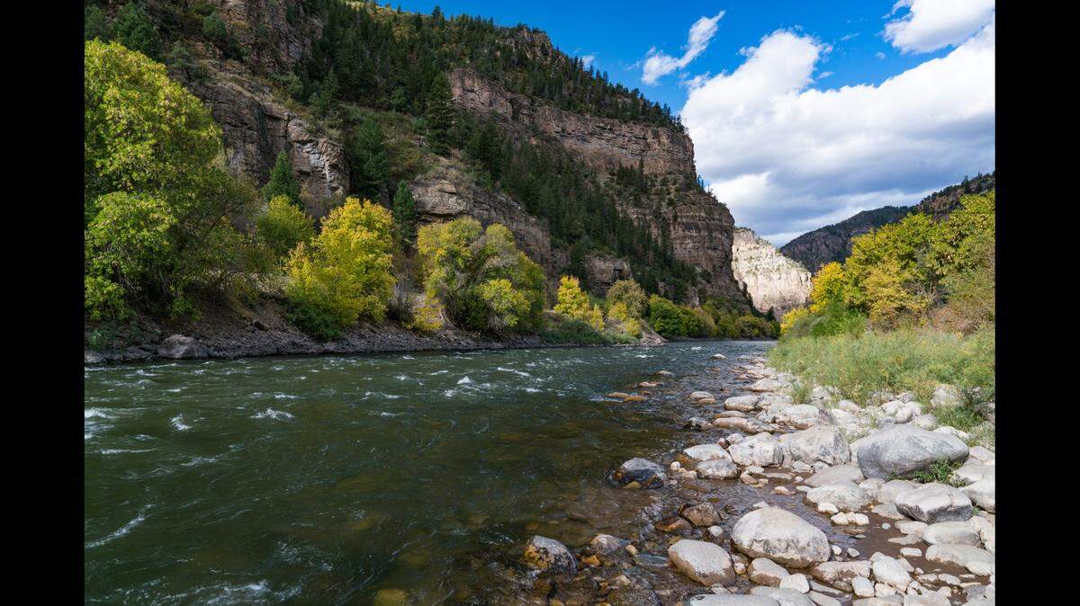 The search is on for a missing man last seen clinging to an overturned raft on a Colorado river, according to a sheriff’s office.