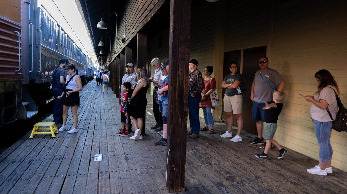 Ticket holders wait to board a passenger car to ride on Saturday, Aug. 9, 2025 in Old Sacramento as the Railroad Museum & Foundation's Granite Rock 10 steam locomotive returned to service .