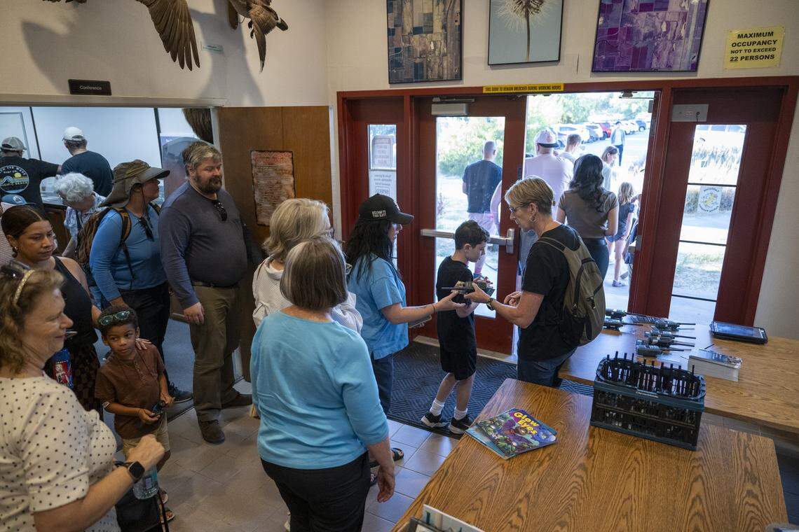 Bat tour participants leave the Yolo Basin Foundation’s presentation room before driving to the Yolo Causeway in Davis on Monday.