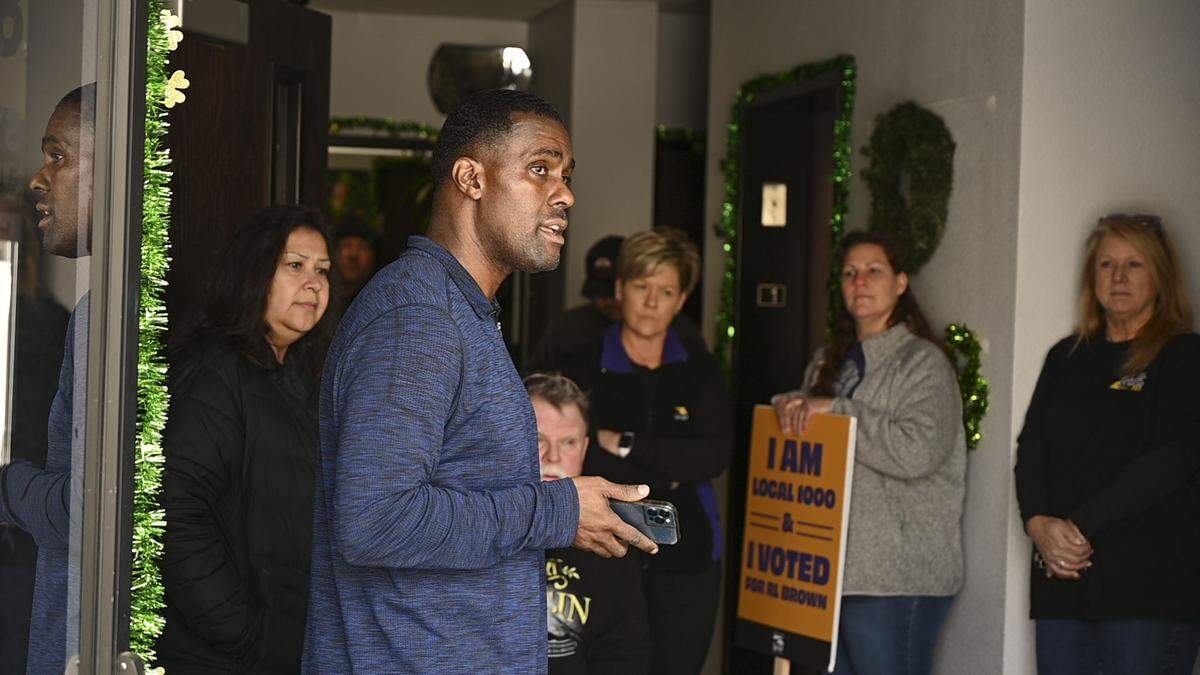 SEIU Local 1000 President Richard Louis Brown and about 20 of his supporters occupy the union’s Sacramento headquarters on March 5 after gaining access without a key. Brown’s supporters, most of whom traveled from rural Lassen County, were outside the building to protest his suspension when a building manager exited through the door. A member of the group grabbed it before it locked, and the group occupied the building.