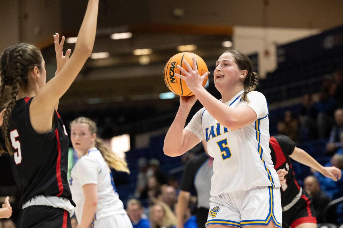Faith Christian’s Lauren Harris shoots over Sacramento Adventist Academy’s Mikayla Meza during the CIF Sac-Joaquin Section Division VI girls basketball championship game at UC Davis on Friday, Feb. 23, 2024, in Davis.