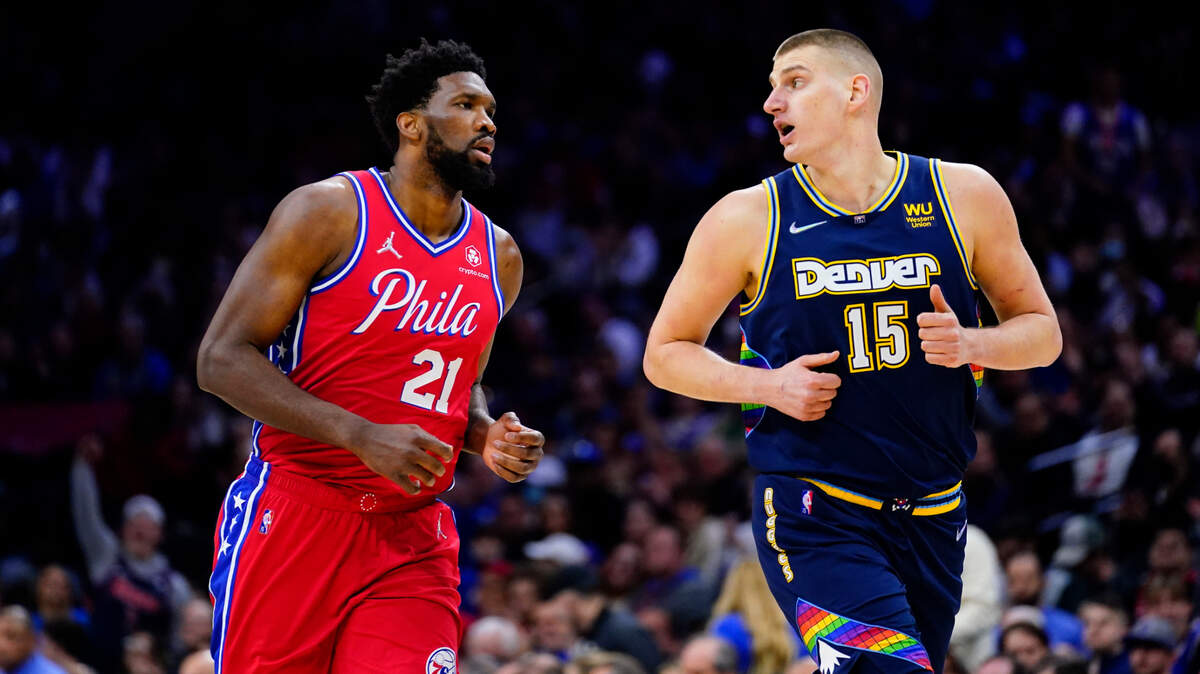 Philadelphia 76ers’ Joel Embiid and Denver Nuggets’ Nikola Jokic play during an NBA basketball game, Monday, March 14, 2022, in Philadelphia. (AP Photo/Matt Slocum)