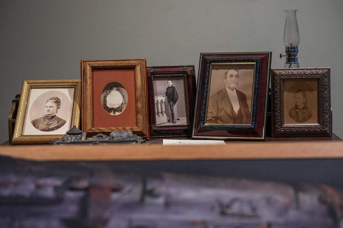 Pictures of May Woolsey’s family are on display at the Sacramento History Museum on March 27. Woolsey died in 1879 at age 12 in Sacramento, and a time capsule chest of her belongings is also on display to help educate students about her life and the history of that time period.