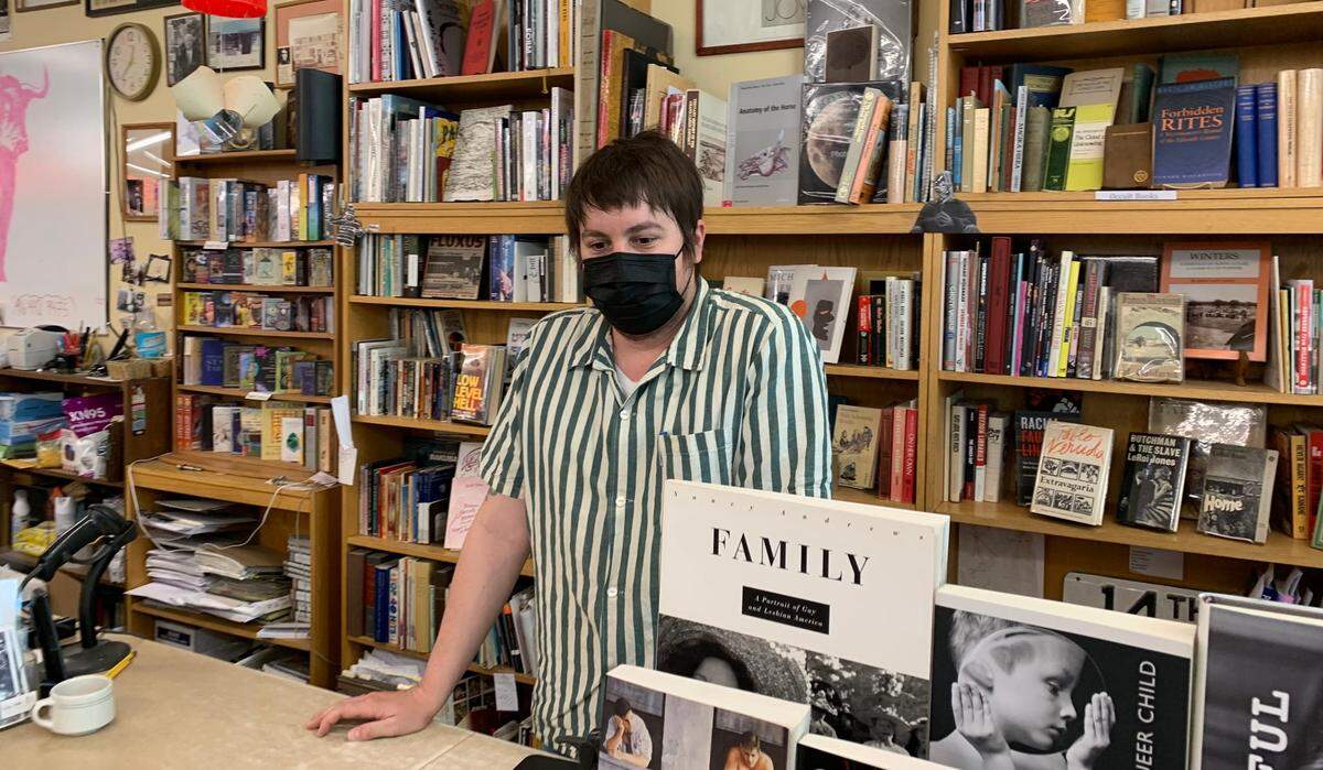 Andrew Naify, manager of Beers Books in Sacramento, where employees and customers still wear masks to guard against COVID-19.
