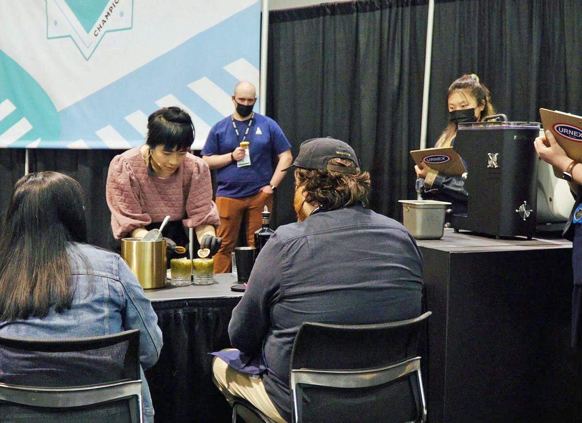 MiMo, the coffee manager of Cora Coffee at 1201 J St., competes in the U.S. Coffee Championships in Boston, Mass., in April 2022. She placed third in the Coffee in Good Spirits category. MiMo’s cold cocktail looked and tasted was made with espresso, tonic water, pineapple rum and blue raspberry Kool-aid. The hot one was made with pineapple syrup, Hennessy, pineapple rum and espresso.