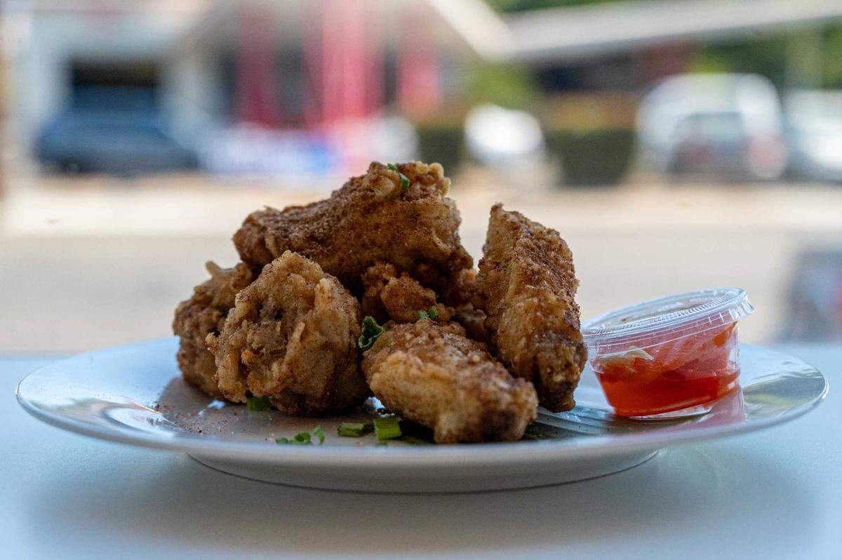 Sinigang chicken wings are at Spoon and Fork in Sacramento on Thursday. The wings are tossed in house-made sinigang seasoning based on the tamarind-based, meat soup.