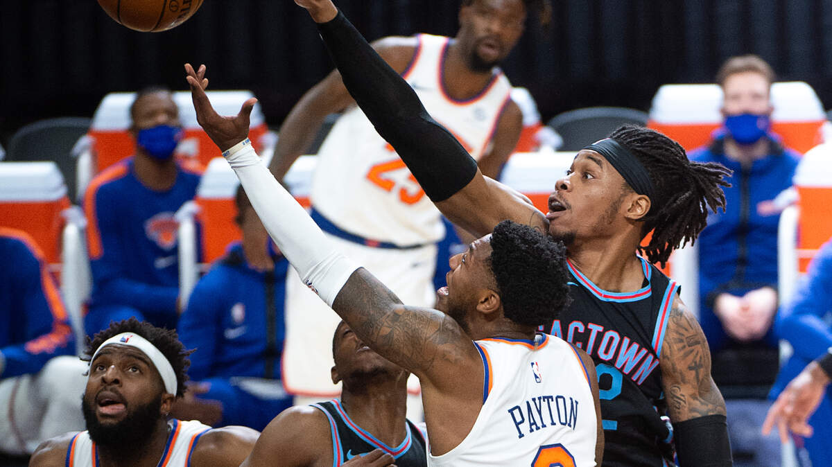 Sacramento Kings center Richaun Holmes (22) battles New York Knicks guard Elfrid Payton (6) during a game in the first quarter at Golden 1 Center on Friday, Jan. 22, 2021 in Sacramento.