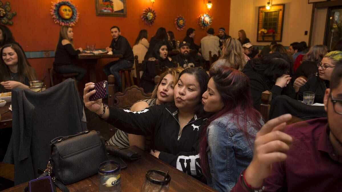 Margarita Matos, from left, Maribel Rojas and Maritza Manzo take a selfie while late night dining at Chando’s Cantina on in March 2017. The midtown Sacramento restaurant closed its door but Chando’s Tacos locations in Roseville, Elk Grove and North Sacramento are still operating.