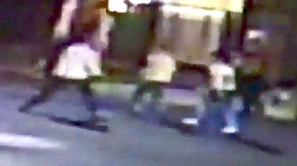 In this cropped screen capture of a surveillance video pointed at 21st and K streets in midtown Sacramento early Thursday, Oct. 8, 2015, Spencer Stone, believed to be the man in a white shirt on the left in this frame, is seen fighting two unknown men. Stone was stabbed in the incident and hospitalized.