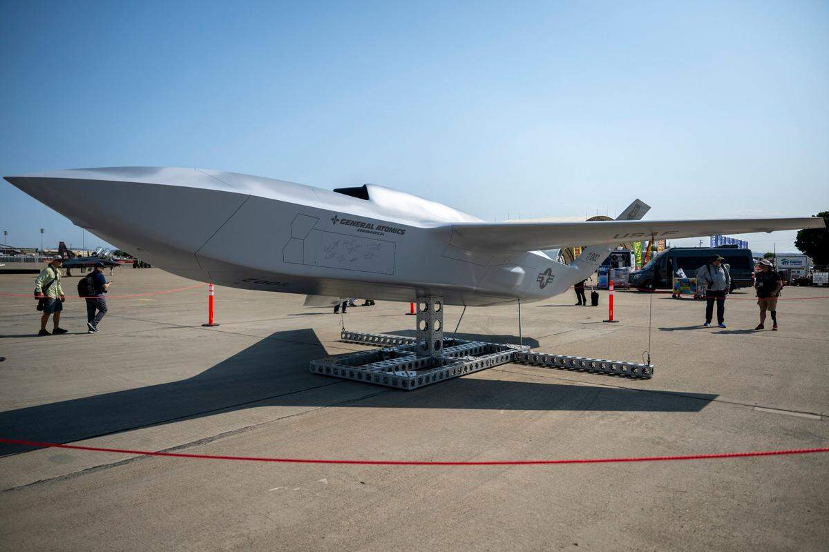 A model of the YFQ42-A collaborative combat aircraft built by defense company General Atomics sits on the apron at Beale Air Force Base on Friday in preparation for the base’s airshow.