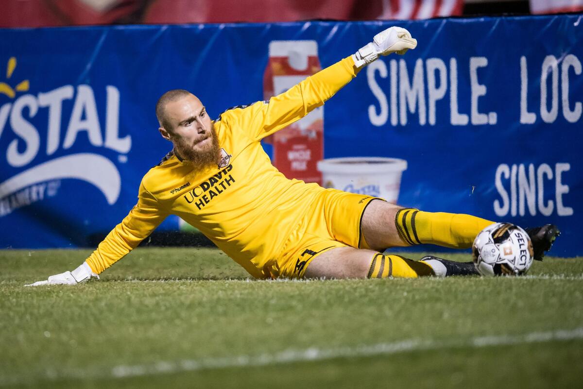 Sacramento Republic FC goalkeeper Danny Vitiello (31) slides to try and keep a ball in play after Louisville City FC misses a scoring opportunity during the second half at the USL soccer game Saturday, April 1, 2023, at Heart Health Park. Sac Republic shut out Louisville 5-0.