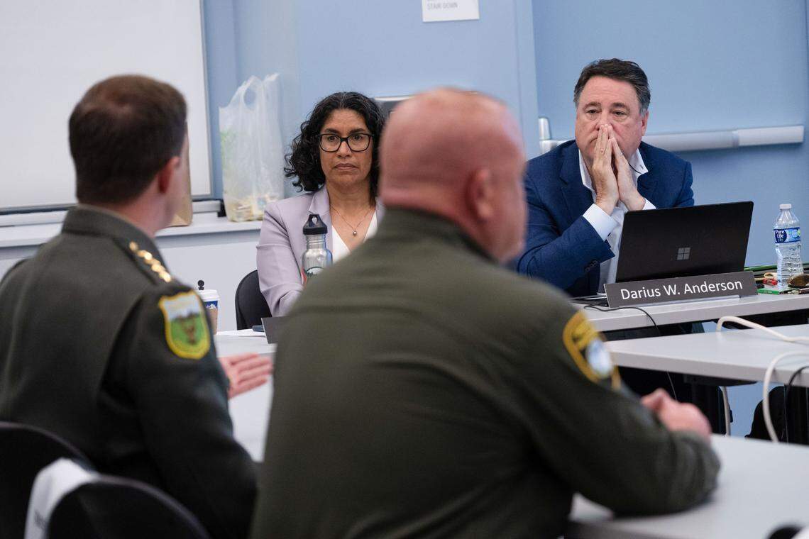California Fish and Game commission members Darius Anderson, right, and Erika Zavaleta, center, listen to Siskiyou County Sheriff Jeremiah LaRue, left, and Glenn County Sheriff Justin Gibbs speak about coyotes at public meeting on Thursday in Sacramento.
