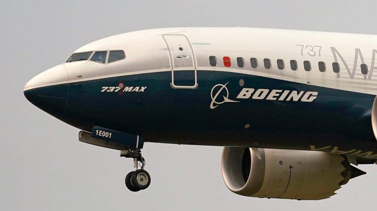 In this file photo from 2020, a Boeing 737 Max jet, piloted by Federal Aviation Administration chief Steve Dickson, prepares to land at Boeing Field following a test flight in Seattle. (AP Photo/Elaine Thompson, File)