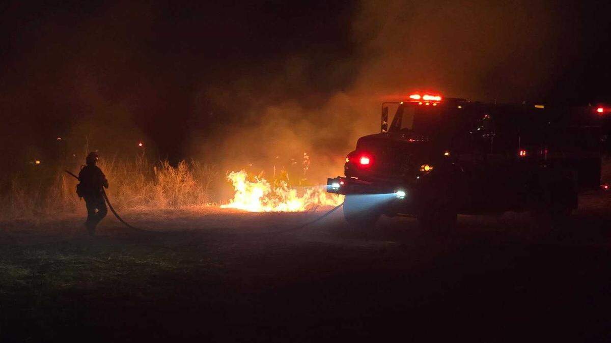Personnel work a hot spot Sunday, March 30, 2025, on the Silver Fire, which has burned roughly 1,250 acres near Bishop and was 0% contained on Monday.