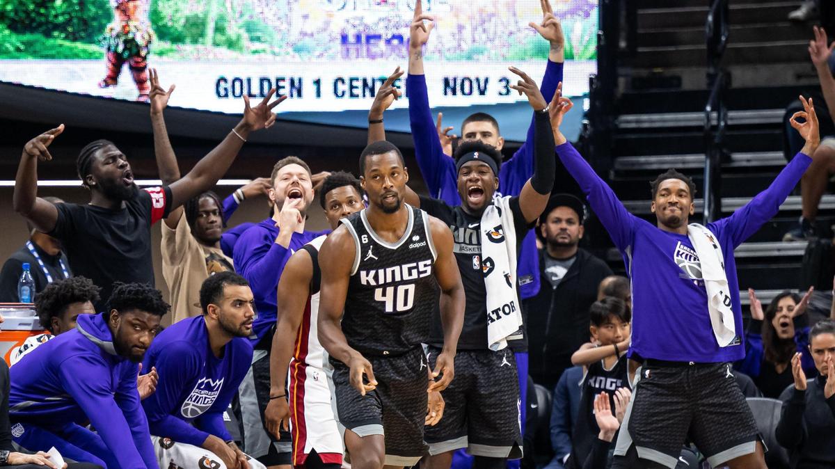 Players on the Sacramento Kings bench spring up to celebrate a three point basket by forward Harrison Barnes (40) against the Miami Heat during second quarter of the NBA basketball game Saturday, Oct. 29, 2022, at Golden 1 Center in Sacramento.