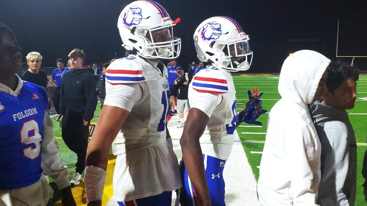 Folsom senior tight end Taniela Tupou shakes hands with Jesuit players after a 55-10 Folsom win Friday at Jesuit High School.