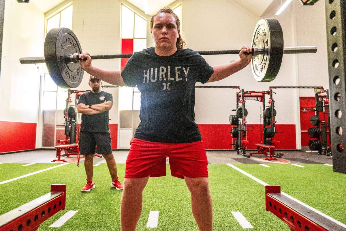 Ryker Woolfe lifts weights in Cordova High School’s new weight room during football spring training on Monday, May 20, 2024.