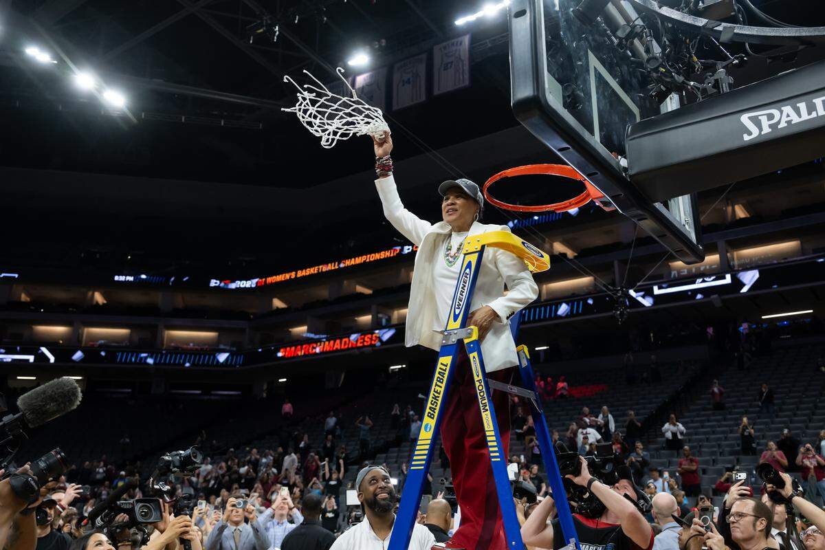 South Carolina Gamecocks head coach Dawn Staley waves the nets after her team beat the Texas Christian University Horned Frogs 78-52 during the NCAA Women’s Basketball Tournament Elite 8 at Golden 1 Center in Sacramento on Monday.