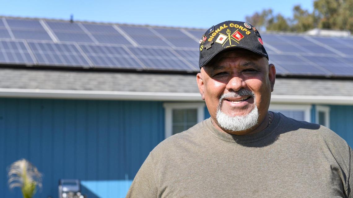 Ramon Torres, who lives in the Madera Ranchos area of Madera County, stands outside his home where solar panels covering the top of his roof on Friday, March 27, 2021. A state proposal would dramatically reduce bill credits paid out by PG&E & other utilities for excess power fed back to the grid. Torres believes this is unfair since those credits helped him finance his solar panels.