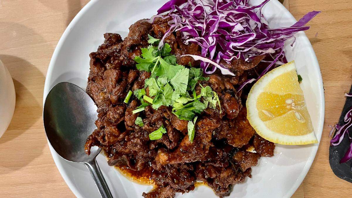 The garlic pork is a rich, slightly sweet hit at Vientiane Restaurant in West Sacramento.