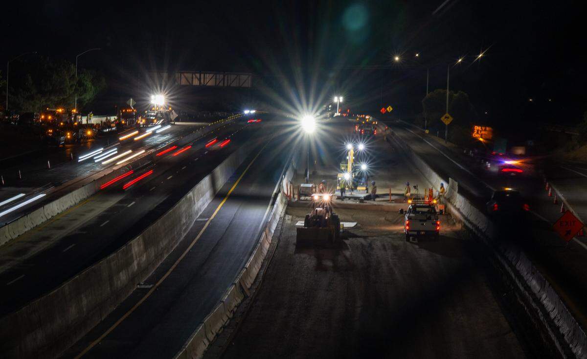 Vehicles drive on Highway 50 during construction lane closures as crews work on a drainage system as a part of the U.S. Highway 50 Multimodal Corridor Enhancement and Rehabilitation Project in June.