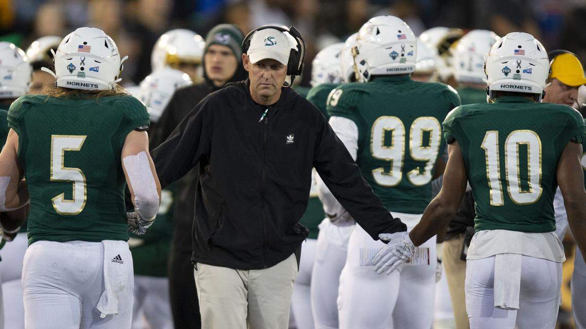 Sac State head coach Troy Taylor greets his team as they come off the field Saturday, Nov. 2, 2019, during the game against Weber State at Hornet Stadium.