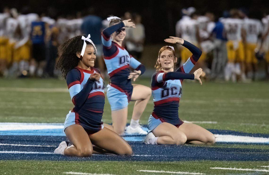 Destiny Christian cheerleaders Kassai Griffin, left, Lily Van Scooter, center, and Celina Taylor perform at halftime on Friday in Rosemont.