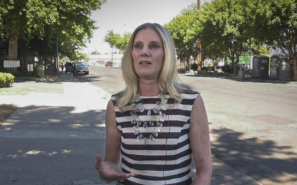“One of the things that is really important is for the social services in the River District and the business community in the River District to find a way to co-exist,” said Jenna Abbott, until recently the head of the River District Property and Business Improvement District, as she stood near A Street last month.