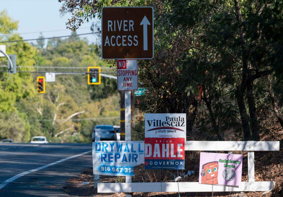 Campaign signs for Republican gubernatorial candidate Brian Dahle and Democratic state Senate candidate Paula Villescaz join a sign for drywall repair along Fair Oaks Boulevard on Wednesday.