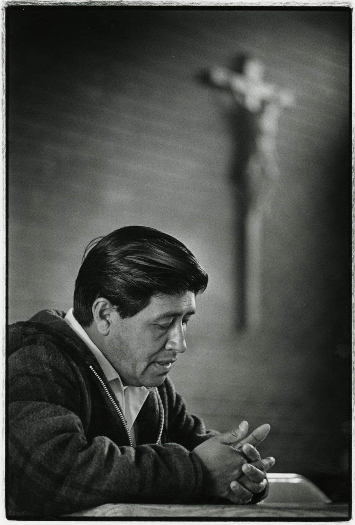 Cesar Chavez sits beneath a crucifix in Sacramento’s Newman Center during a visit on April 4, 1968, in his early years as leader of the United Farm Workers Union. He visited Sacramento to speak about a grape boycott and then-presidential candidate Robert F. Kennedy.