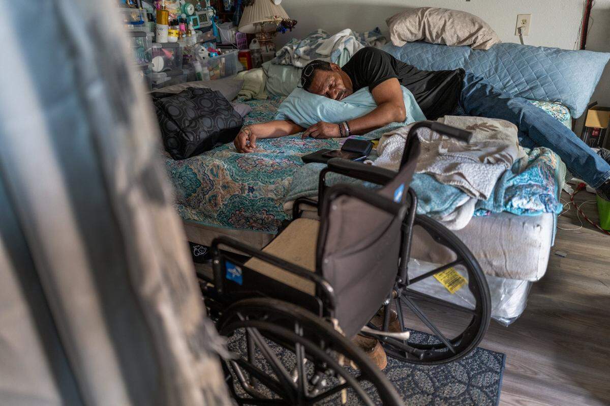Shawn White rests after taking an assortment of medicines and vitamins, including pain medication in March. He and his wife Brenda had been packing to depart Easter Sunday. They were given a short extension but they had no idea where they would go. White, whose disability check is too small for Sacramento’s escalating rental market, said he wished he was well enough to get a job.