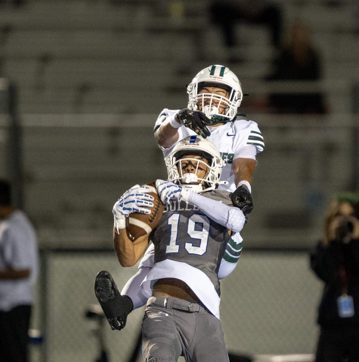 Folsom Bulldogs defensive back Jason Hill Jr. (19) intercepts a pass against the Granite Bay Grizzlies in October. Hill signed with Stanford. 