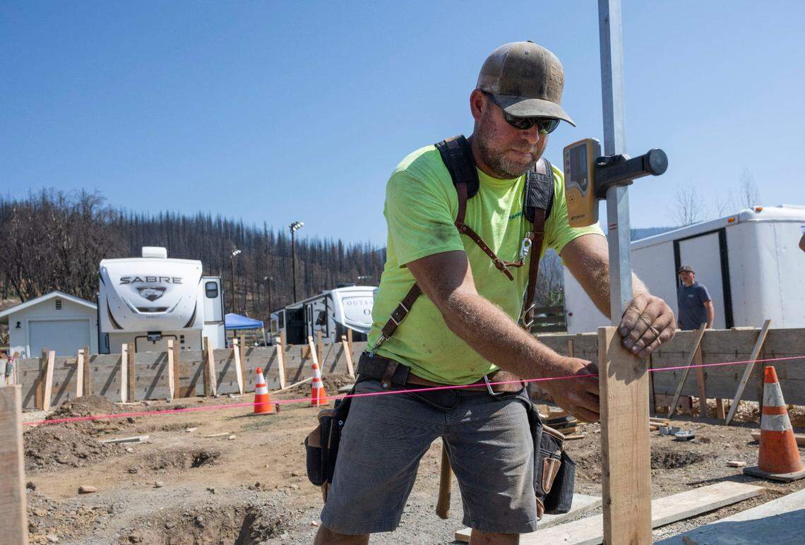 Colby Rainwater with Rainwater Construction of Chico works on rebuilding the home of Primo and Debbie Cassol on Thursday in Greenville.