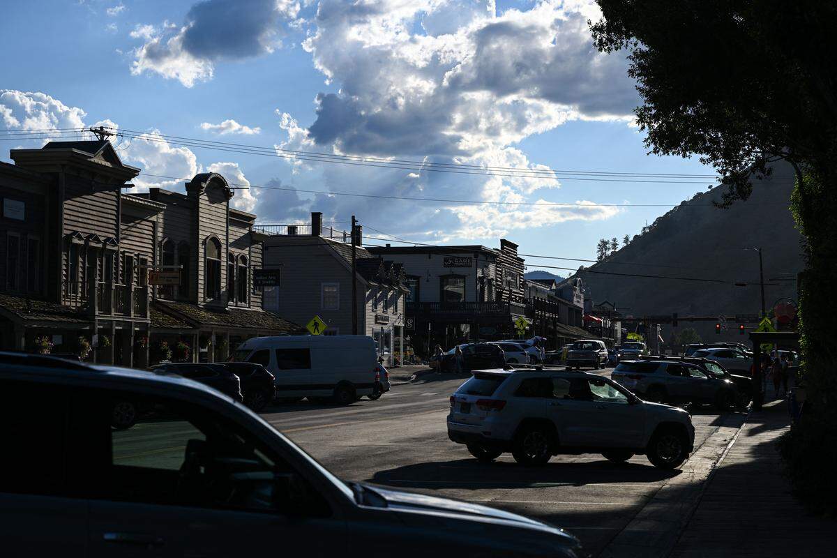 Vehicles and businesses are seen around the Jackson Town Square in Jackson, Wyoming on August 15, 2022. - The Wyoming Republican primary election will be held on August 16. (Photo by Patrick T. FALLON / AFP) (Photo by PATRICK T. FALLON/AFP via Getty Images)