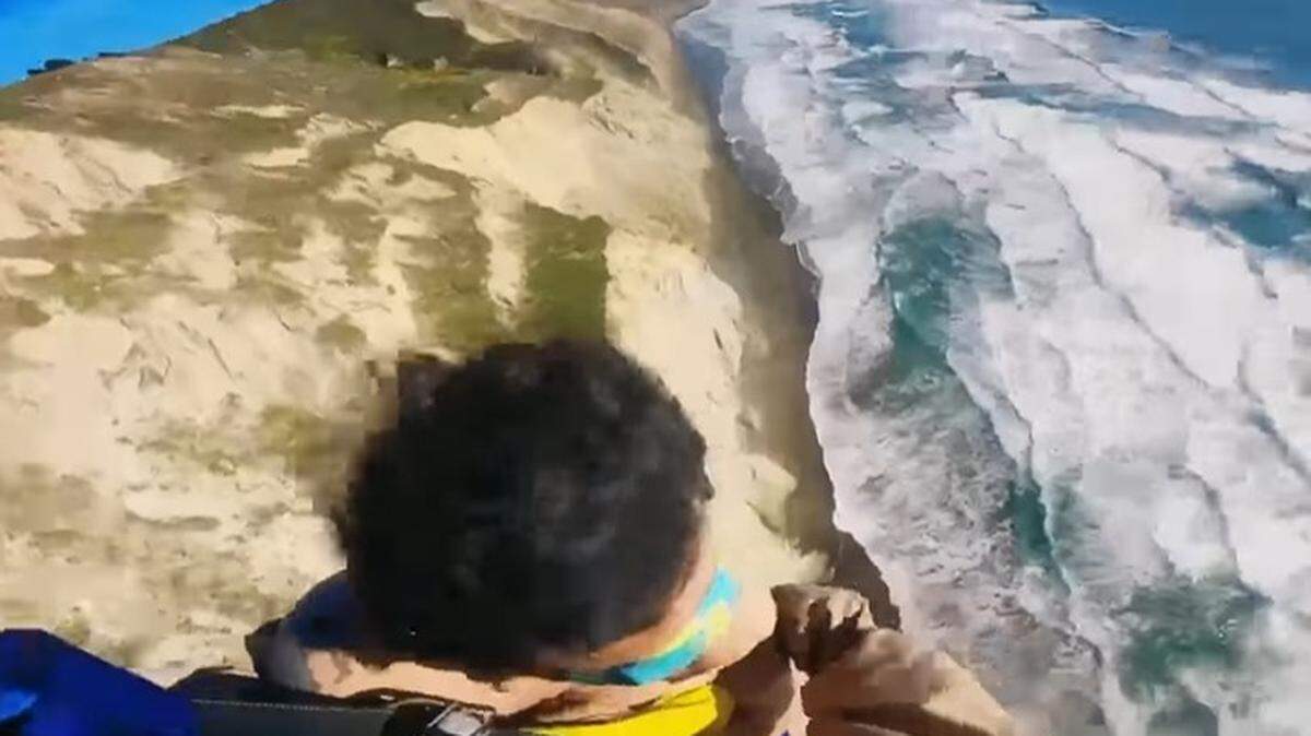 A California Highway Patrol helicopter rescued a man found clinging to a 500-foot cliff near Mussel Rock in Daly City, officials say.