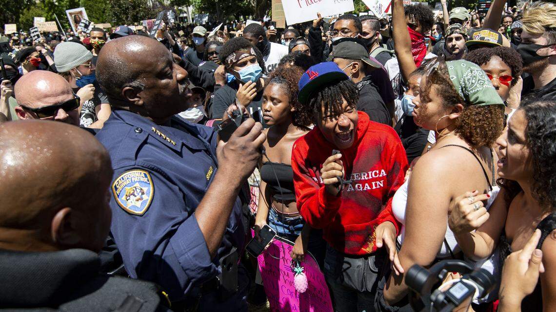 California Highway Patrol Commissioner Warren Stanley speaks with protesters on the east steps of the California State Capitol on Saturday, June 6, 2020. A group of protesters jumped the fence surrounding the steps after marching from Golden 1 Center to Cesar E. Chavez Plaza to protest the killing of George Floyd.