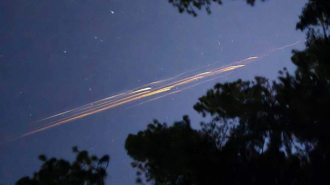 A Starlink satellite that broke up as it re-entered the atmosphere is seen over the skies of Grass Valley on Thursday, Sept. 25, 2025.